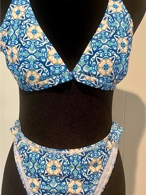 Women’s size medium bikini.  Blue and yellow floral pattern.  Top ties in back.